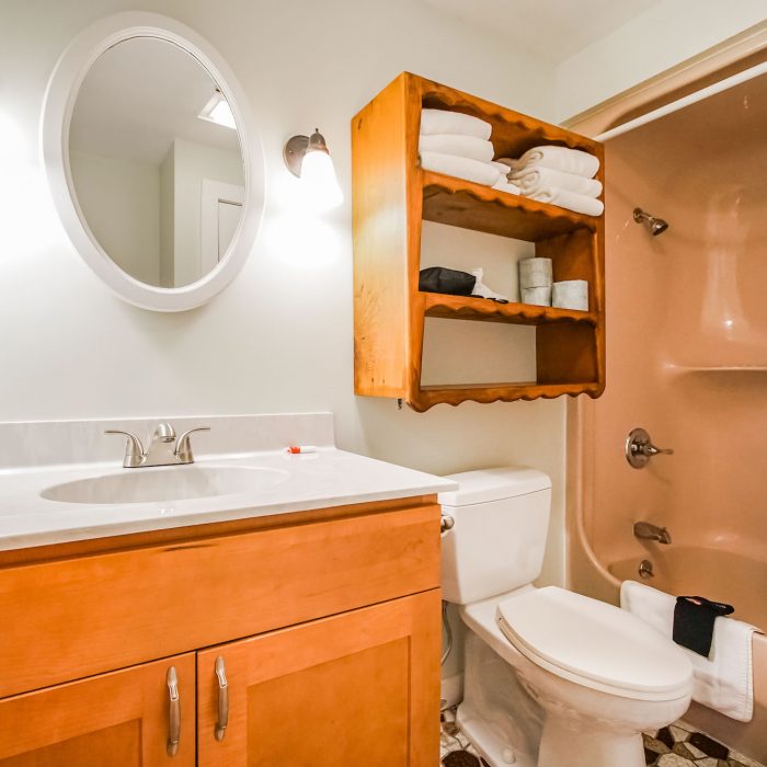 Photo of bathroom showcasing sink, toilet, tub/shower